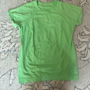 Green athletic girl top
